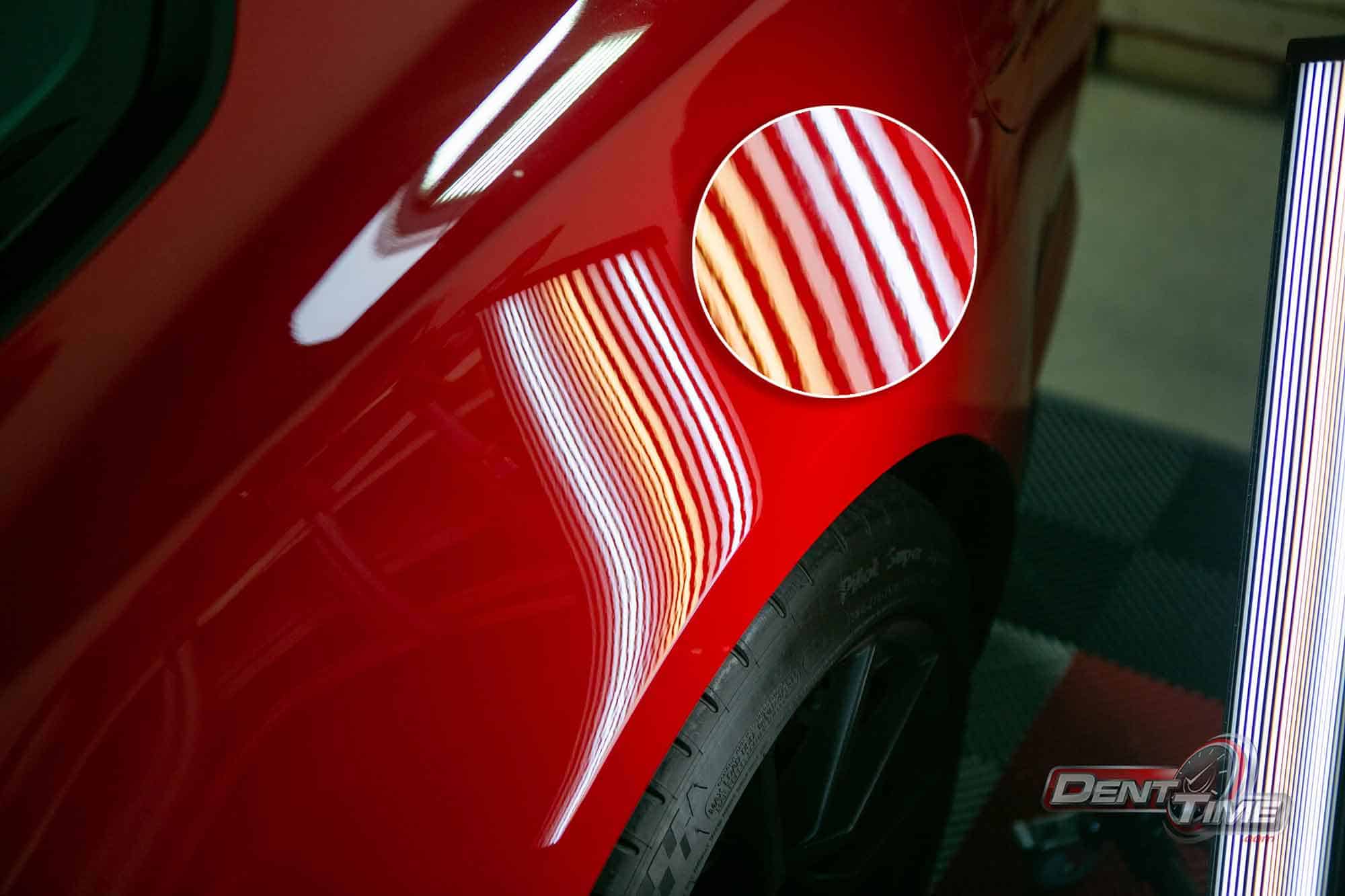 Panel after door ding repair, reflection-board lines perfectly straight, San Diego